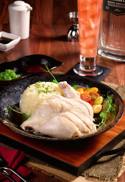 Singapore Chicken Rice (steamed half chicken, rice, tomato salad, ginger scallion sauce, chili sauce, dark soy sauce)